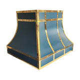 curved matte blue stainless steel kitchen hood framed with polished brass straps and decorative rivets for luxury farmhouse kitchen design