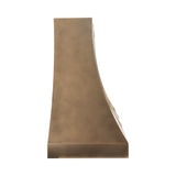 handcrafted curved metal range hood with premium brass finish