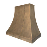 slope view of traditional brass kitchen range hood with curved silhouette