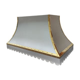 refined curved stainless steel chimney range hood with polished gold rivet trim and decorative scalloped bottom edge for luxury farmhouse kitchen renovation full view
