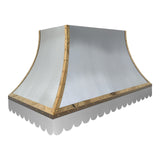 refined curved stainless steel island chimney range hood with polished brass rivet trim and decorative scalloped bottom edge for luxury farmhouse kitchen renovation whole view