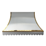 refined curved stainless steel island chimney range hood with polished brass rivet trim and decorative scalloped bottom edge for luxury farmhouse kitchen renovation side view