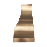bell shaped brass range hood with straps and small round rivets for luxury kitchen design side view
