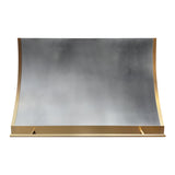 sleek slope shaped zinc wall chimney range hood with brass side and bottom trim plus front hanging rail for modern kitchen design front view