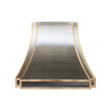 full front view of handcrafted stainless steel range hood with curved design and integrated brass detailing