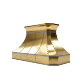 mirror polished brass kitchen hood with curved crown and stainless large round rivets