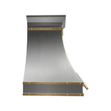 Custom stainless steel range hood with an elegant curved design, gold accent trim, and handcrafted details for a luxury modern kitchen side view
