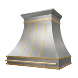 Custom stainless steel range hood with an elegant curved design, gold accent trim, and handcrafted details for a luxury modern kitchen slope view