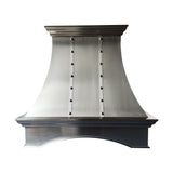 refined curved brushed stainless steel custom kitchen hood with vertical riveted straps, top and bottom crown molding and arched base for farmhouse transitional kitchen front view