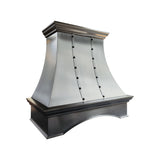 refined curved brushed stainless steel custom kitchen hood with vertical riveted straps, top and bottom crown molding and arched base for farmhouse transitional kitchen 