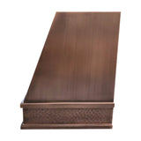 medium copper vent hood with geometric design and hammered texture,brushed hood body and hammered apron side view