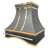 stainless steel range hood with matte black finish, polished brass straps and rivet details, luxury handcrafted kitchen vent hood