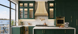prime custom brass range hood with decorative straps and rivets