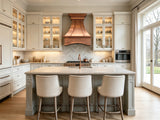 wall mount classic curved copper range hood in transitional kitchen