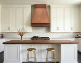 antique copper vent hood in modern kitchen